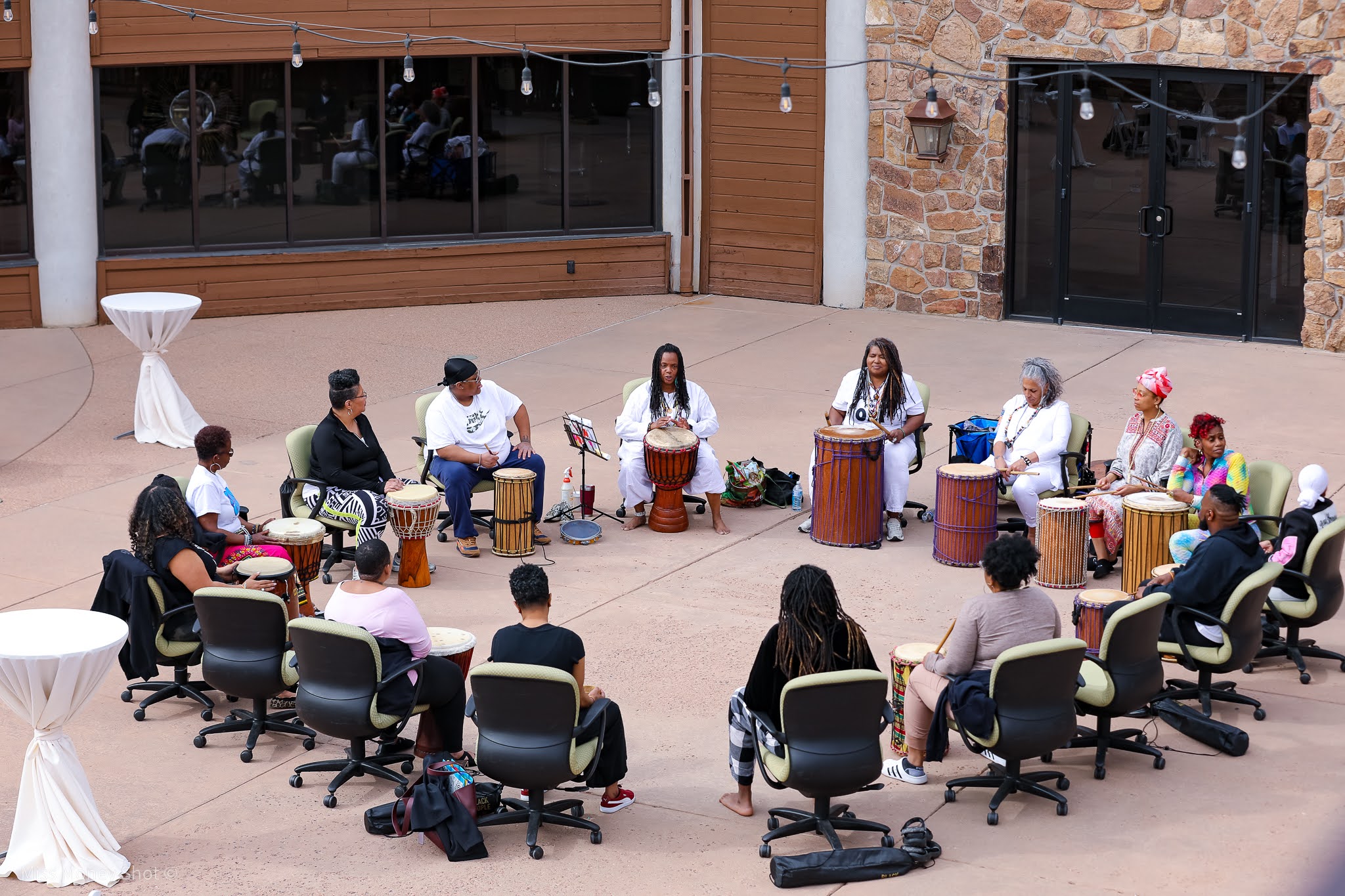 Drum circle outdoors in a courtyard
